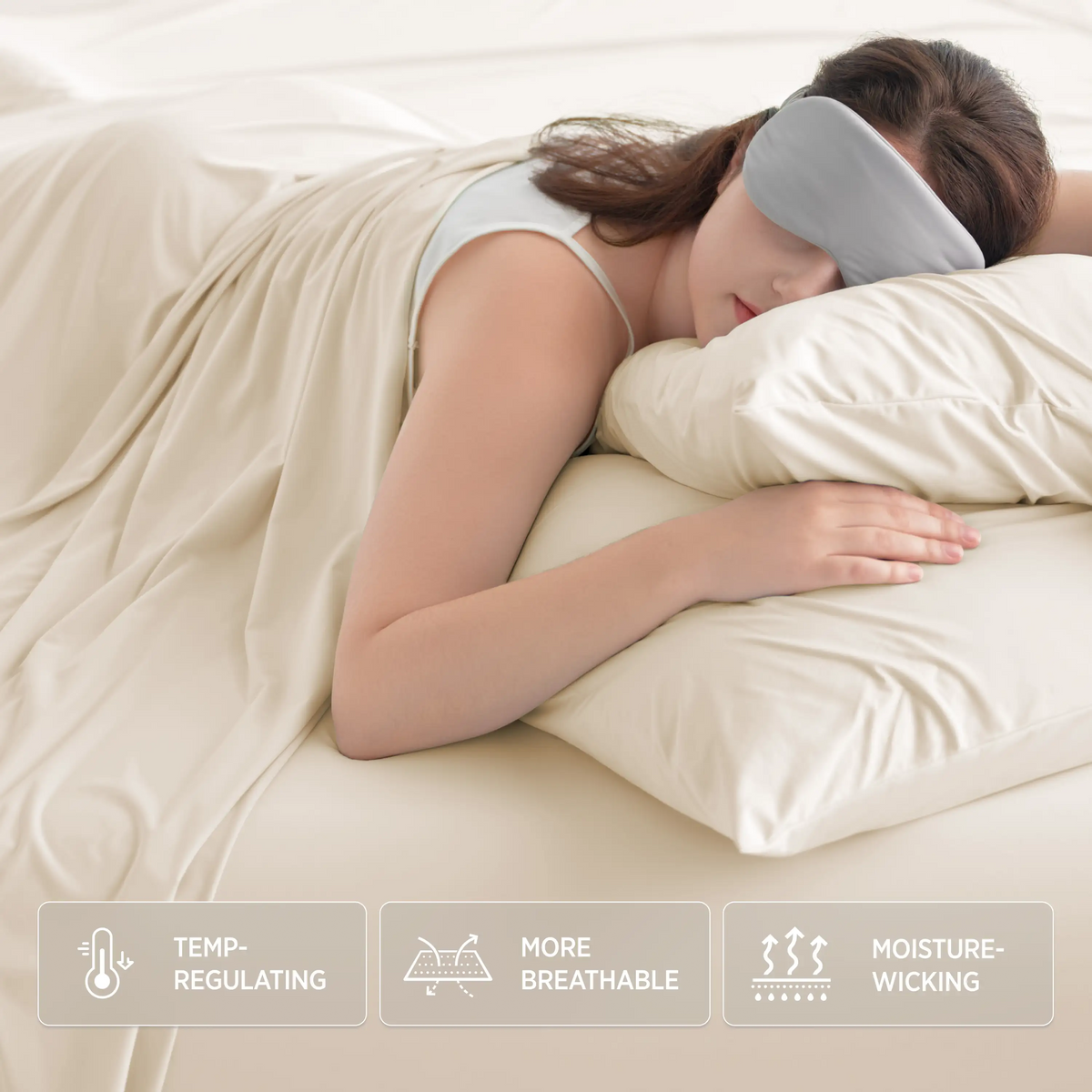 Woman with grey eye mask sleeps on ivory Breescape cooling sheets. Features: Temp-regulating, breathable, moisture-wicking.